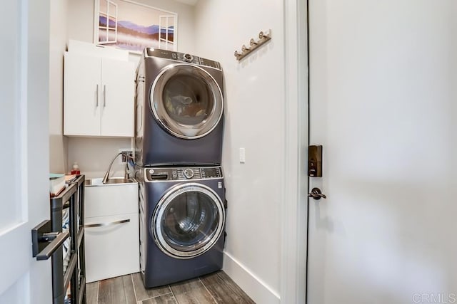 2255 Via Dulcea, Fallbrook, CA 92028 - washroom with cabinet space, estacked washer and dryer, and wood finished floors