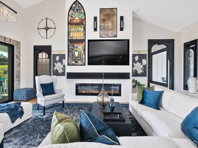2255 Via Dulcea, Fallbrook, CA 92028 - living area with a glass covered fireplace, lofted ceiling, and wood finished floors