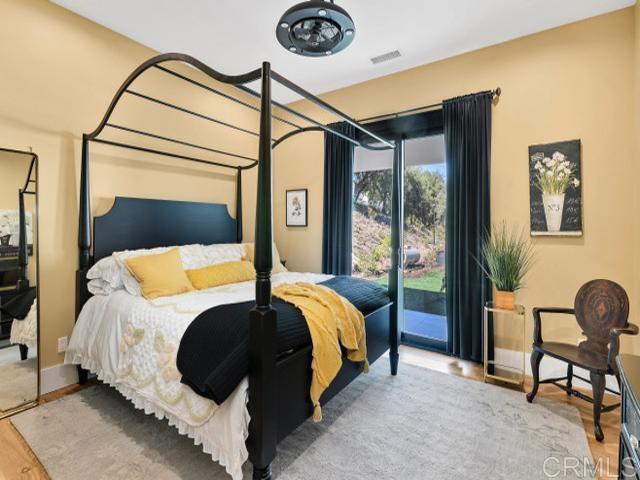 2255 Via Dulcea, Fallbrook, CA 92028 - bedroom with wood finished floors and access to outside