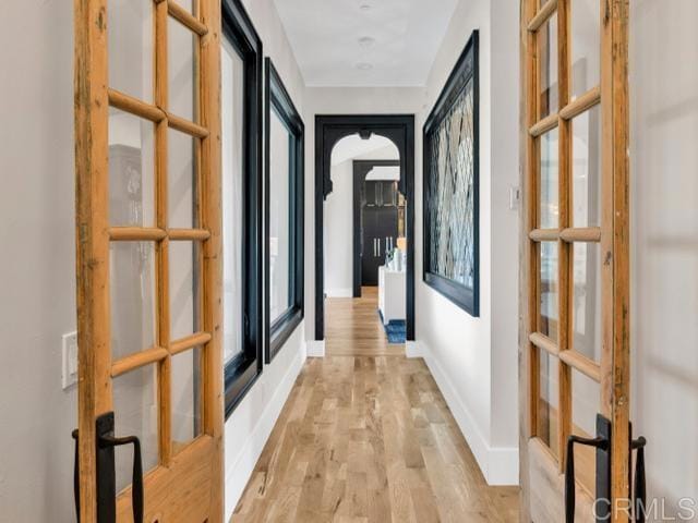 2255 Via Dulcea, Fallbrook, CA 92028 - hall with french doors, light wood-style floors, and healthy amount of natural light