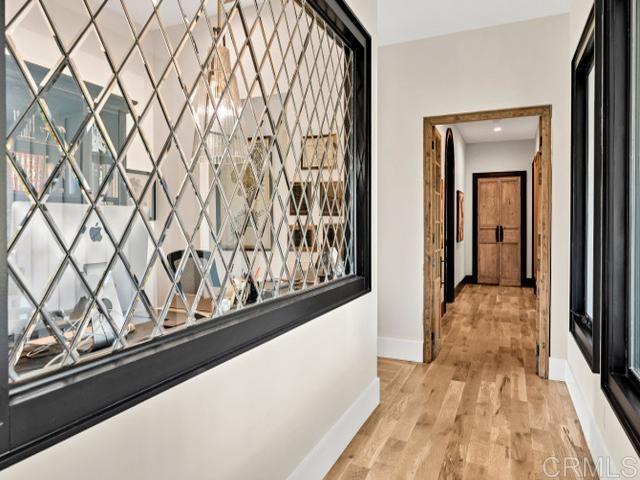 2255 Via Dulcea, Fallbrook, CA 92028 - hallway with baseboards and light wood-type flooring