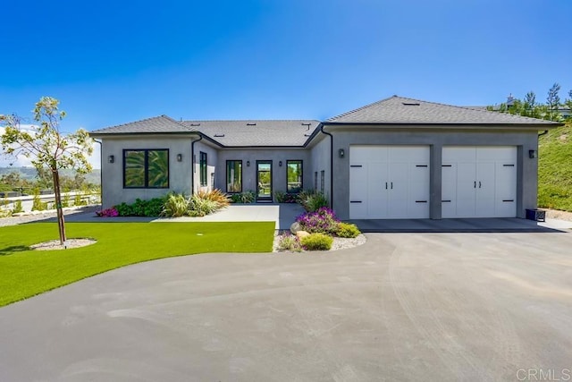 2255 Via Dulcea, Fallbrook, CA 92028 - view of front of home featuring a garage, stucco siding, driveway, and a front lawn