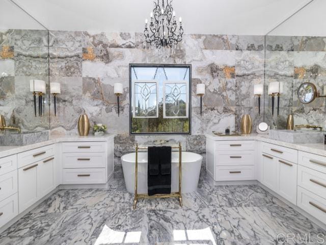 2255 Via Dulcea, Fallbrook, CA 92028 - bathroom with a freestanding bath, a chandelier, marble finish flooring, and vanity