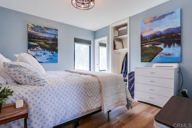 2255 Via Dulcea, Fallbrook, CA 92028 - bedroom with wood finished floors and a chandelier