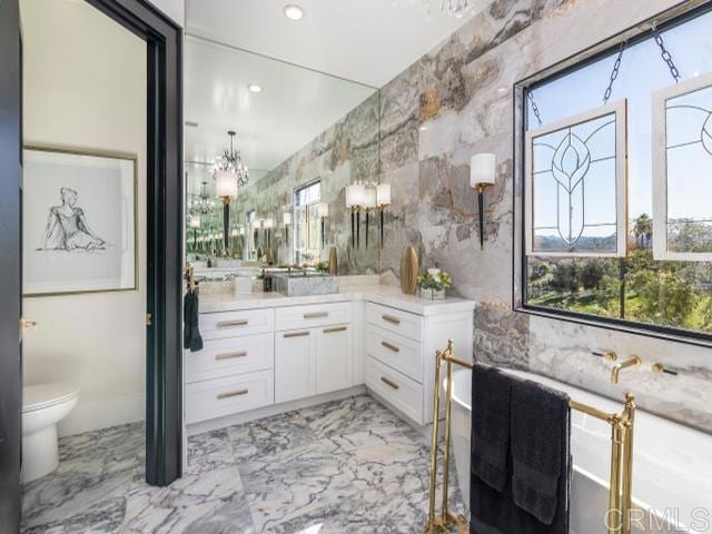 2255 Via Dulcea, Fallbrook, CA 92028 - bathroom featuring vanity, marble finish floors, healthy amount of natural light, and recessed lighting