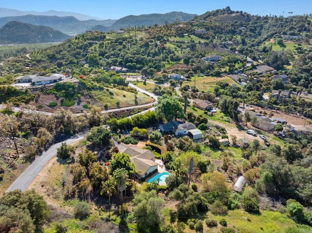 birds eye view of property featuring a mountain view