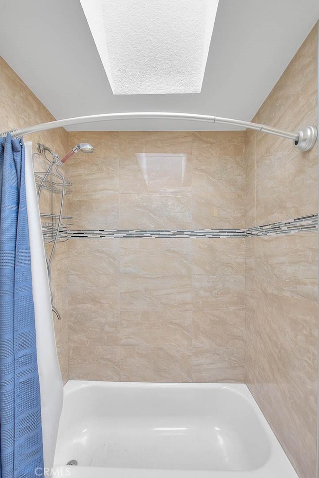 bathroom featuring shower / bath combination with curtain