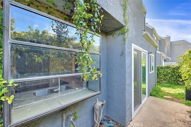 view of property exterior with stucco siding