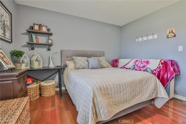 13720 Woodcock Ave, Sylmar, CA 91342 - bedroom featuring wood finished floors and baseboards