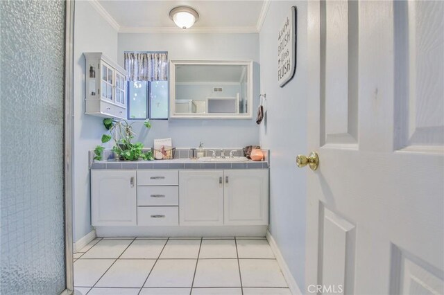13720 Woodcock Ave, Sylmar, CA 91342 - bathroom with ornamental molding, vanity, baseboards, and tile patterned floors