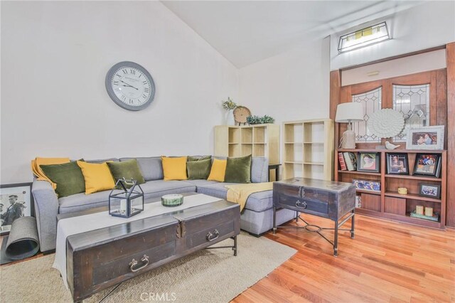 13720 Woodcock Ave, Sylmar, CA 91342 - living room with vaulted ceiling and wood finished floors