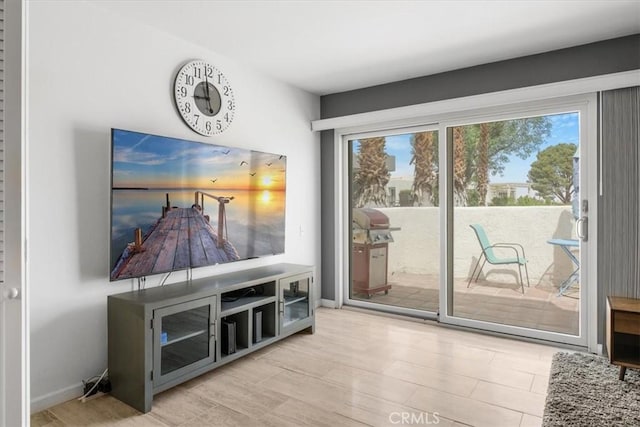 1692 Fairway Cir, Palm Springs, CA 92264 - doorway to outside with baseboards, wood finished floors, and a wealth of natural light