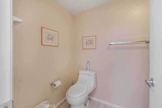 1692 Fairway Cir, Palm Springs, CA 92264 - bathroom featuring wood finished floors and toilet