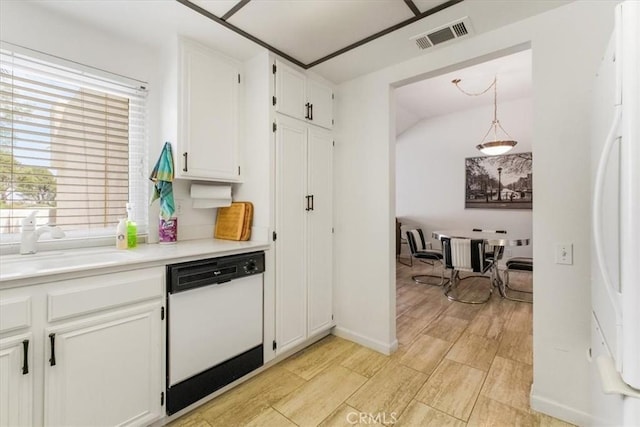 1692 Fairway Cir, Palm Springs, CA 92264 - kitchen with white cabinets, a sink, fridge, visible vents, and white dishwasher