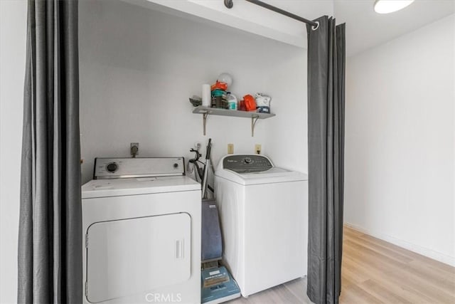 1692 Fairway Cir, Palm Springs, CA 92264 - washroom featuring light wood-style flooring, independent washer and dryer, and laundry area