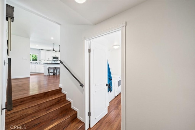 stairs with recessed lighting and wood finished floors