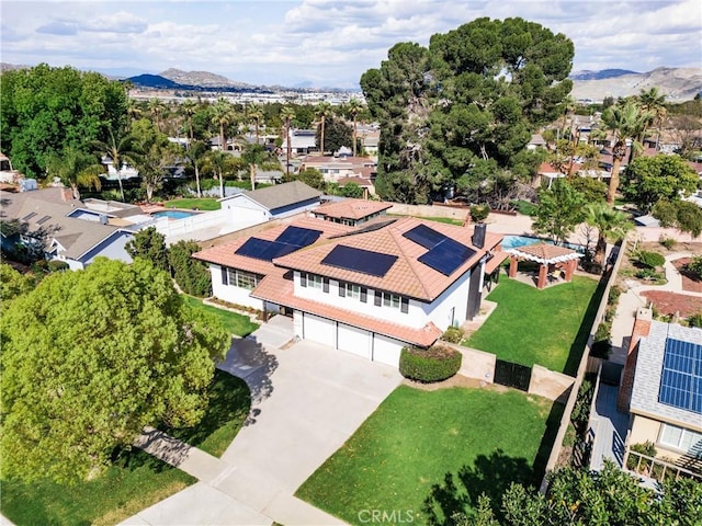 aerial view with a mountain view and a residential view