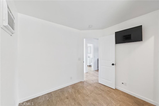 empty room with visible vents and baseboards