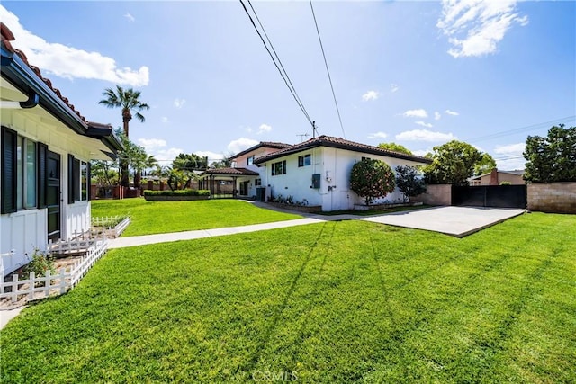 view of yard with a patio and fence