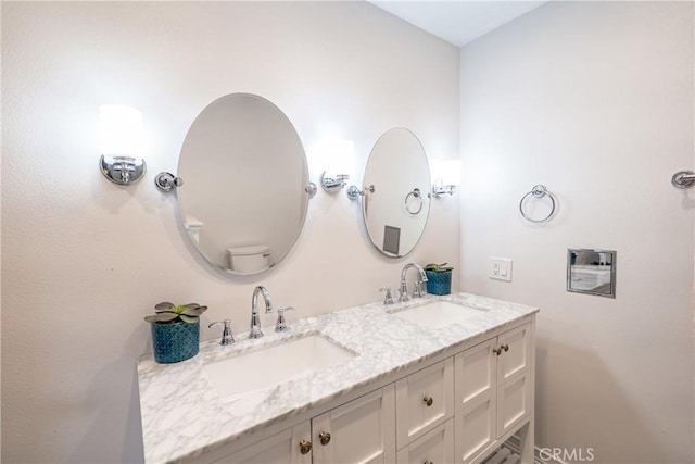 bathroom with double vanity and a sink