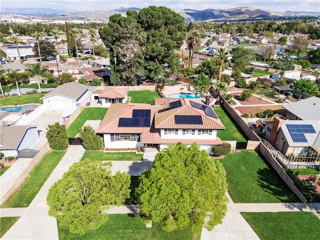 birds eye view of property featuring a mountain view and a residential view