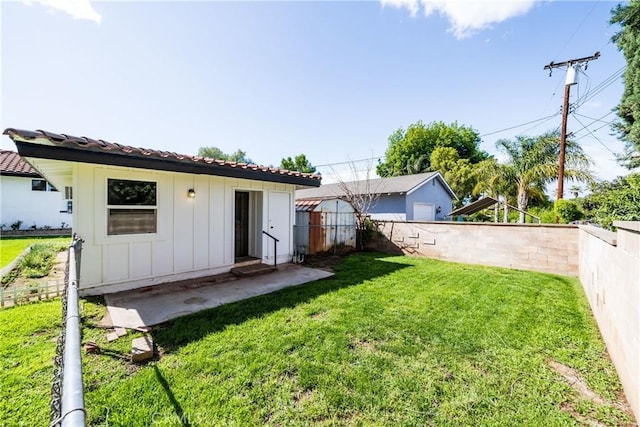 view of yard featuring a patio and a fenced backyard