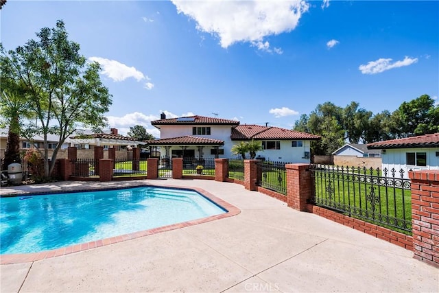 view of pool featuring a fenced in pool, fence private yard, and a lawn