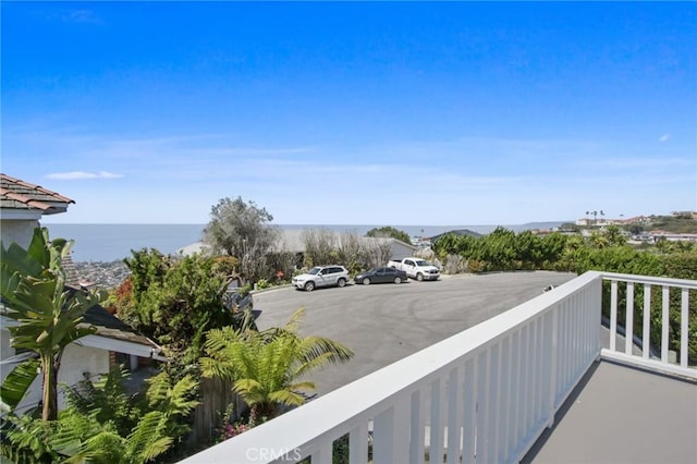 balcony featuring a water view