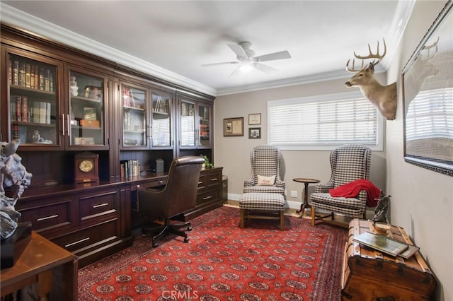 home office featuring ornamental molding, ceiling fan, and baseboards