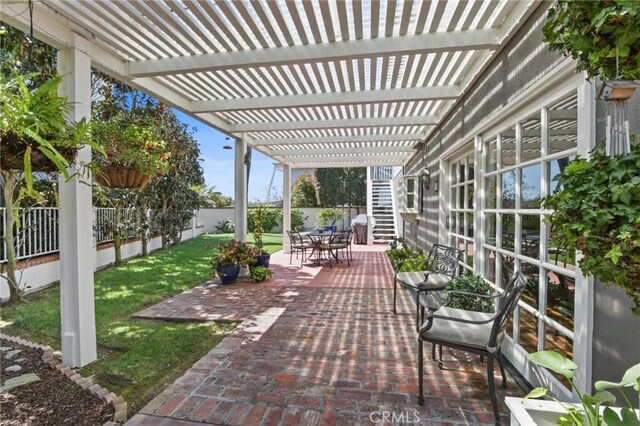 view of patio / terrace with outdoor dining space, a fenced backyard, and a pergola