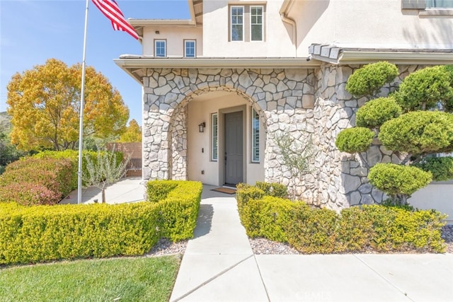 30088 Mauroux Ct, Murrieta, CA 92563 - doorway to property with stucco siding and stone siding