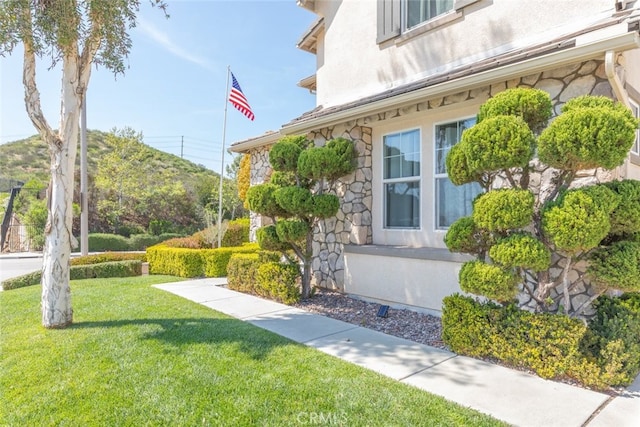 30088 Mauroux Ct, Murrieta, CA 92563 - view of property exterior featuring a yard, stucco siding, and stone siding
