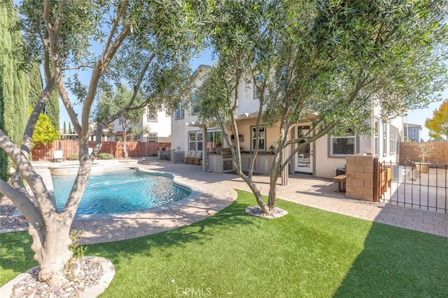 30088 Mauroux Ct, Murrieta, CA 92563 - view of swimming pool with a fenced in pool, a patio, a fenced backyard, and a yard