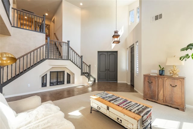 30088 Mauroux Ct, Murrieta, CA 92563 - interior space featuring a towering ceiling, baseboards, visible vents, and stairs