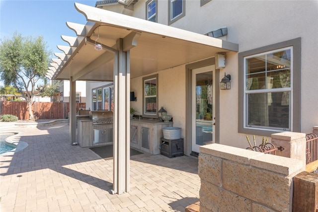 30088 Mauroux Ct, Murrieta, CA 92563 - view of patio featuring grilling area, a fenced in pool, fence, and exterior kitchen