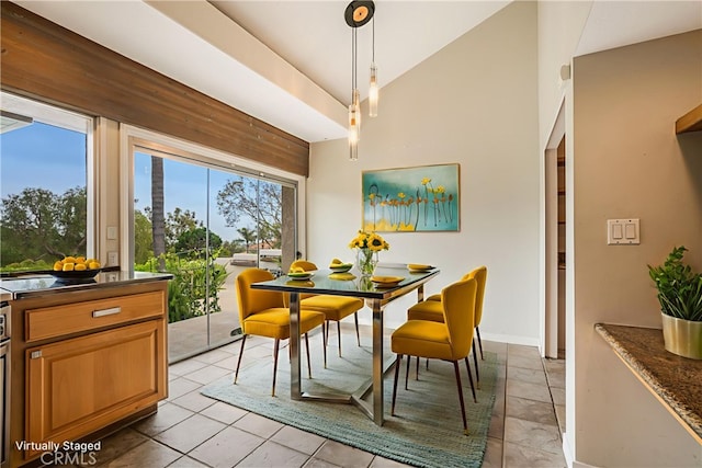 166 Alviso Dr, Camarillo, CA 93010 - dining space featuring vaulted ceiling and baseboards
