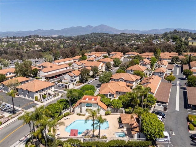 23325 La Crescenta Unit D, Mission Viejo, CA 92691 - aerial perspective of suburban area with a pool area and mountains