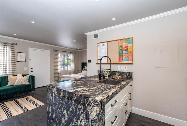 23325 La Crescenta Unit D, Mission Viejo, CA 92691 - kitchen featuring a sink, open floor plan, dark wood-style flooring, white cabinetry, and crown molding