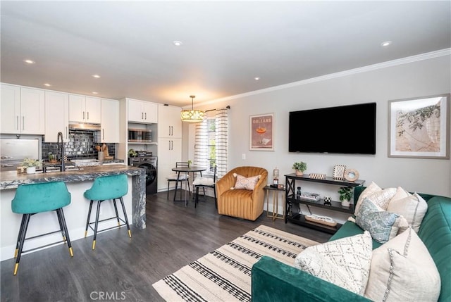 23325 La Crescenta Unit D, Mission Viejo, CA 92691 - living room with ornamental molding, dark wood-type flooring, washer / dryer, recessed lighting, and baseboards