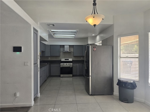 37623 Teal St, Palmdale, CA 93552 - kitchen featuring stainless steel appliances, wall chimney exhaust hood, gray cabinetry, baseboards, and light tile patterned flooring