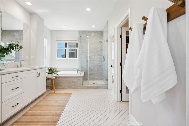 full bath with a garden tub, a shower stall, vanity, recessed lighting, and tile patterned floors