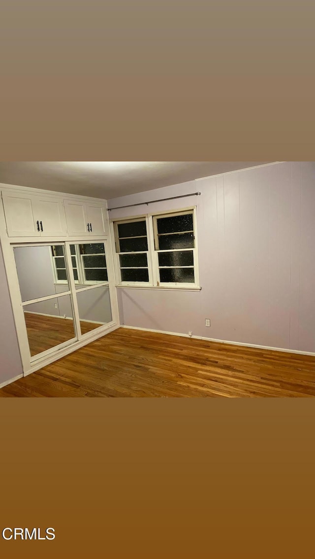 unfurnished room featuring wood finished floors