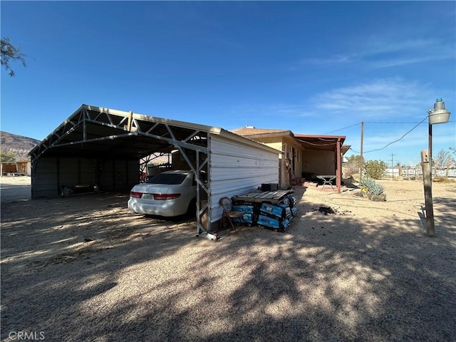 44531 Tioga St, Newberry Springs, CA 92365 - view of outdoor structure with a carport and driveway