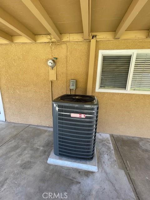 details with central AC and stucco siding