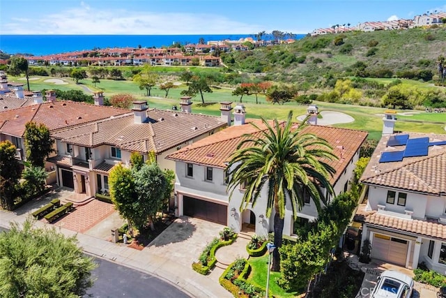 drone / aerial view with a water view and a residential view