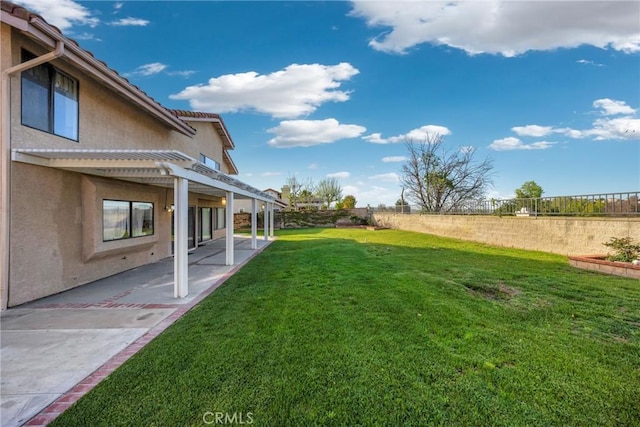 view of yard with a patio area and a fenced backyard