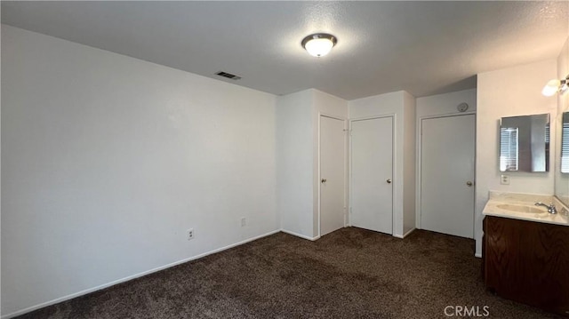 20211 Carlisle Rd, Apple Valley, CA 92307 - unfurnished bedroom featuring dark carpet and a sink