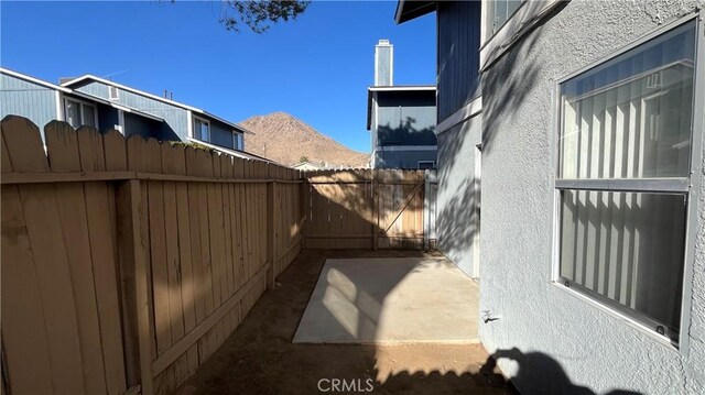 20211 Carlisle Rd, Apple Valley, CA 92307 - view of side of home featuring a patio and stucco siding