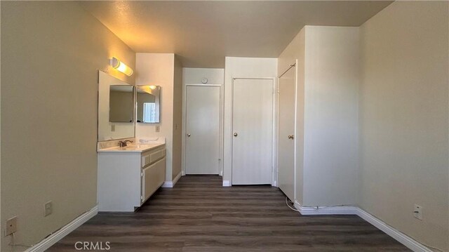 20211 Carlisle Rd, Apple Valley, CA 92307 - bathroom with wood finished floors, vanity, and baseboards