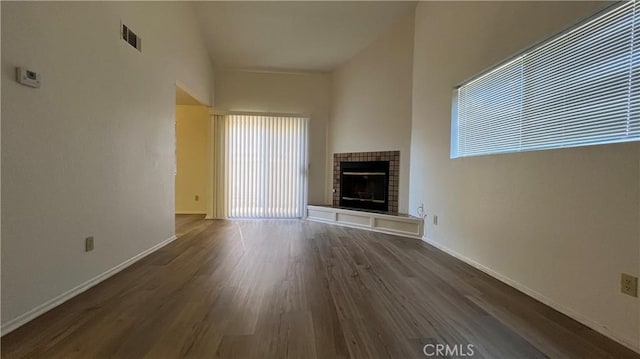 20211 Carlisle Rd, Apple Valley, CA 92307 - unfurnished living room featuring dark wood finished floors, a fireplace, and baseboards